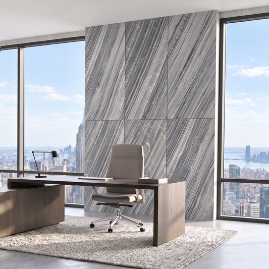 Lanita gray stone veneer feature wall behind an office desk with city views.