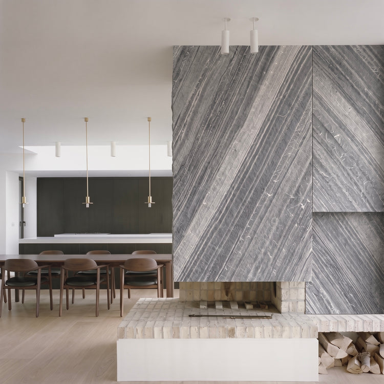 Lanita fireplace surround application beside an open kitchen and dining area.