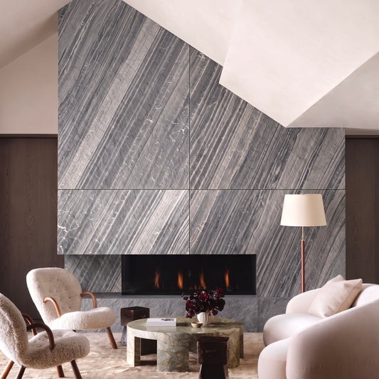 Lanita gray stone veneer fireplace application view in a warm living room.