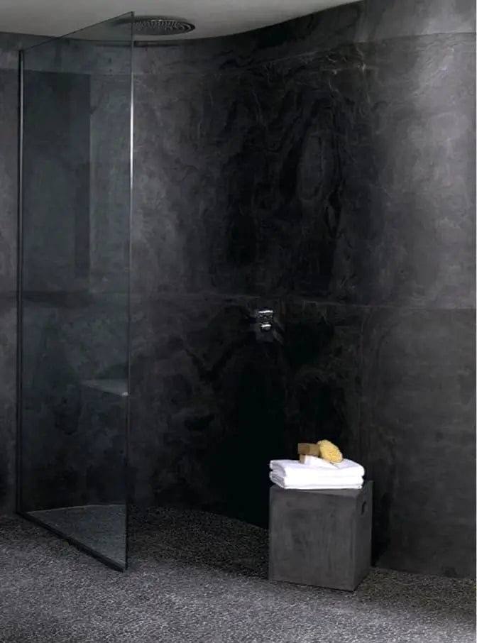Asita slate stone veneer walls in a walk-in shower enclosure.