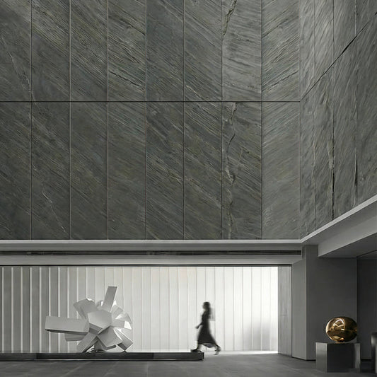 Mantra grey slate stone veneer cladding on a tall facade feature wall.