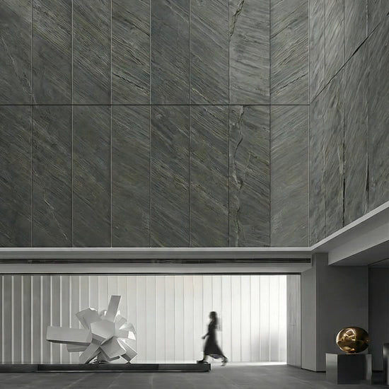 Mantra grey slate stone veneer cladding on a tall facade feature wall.