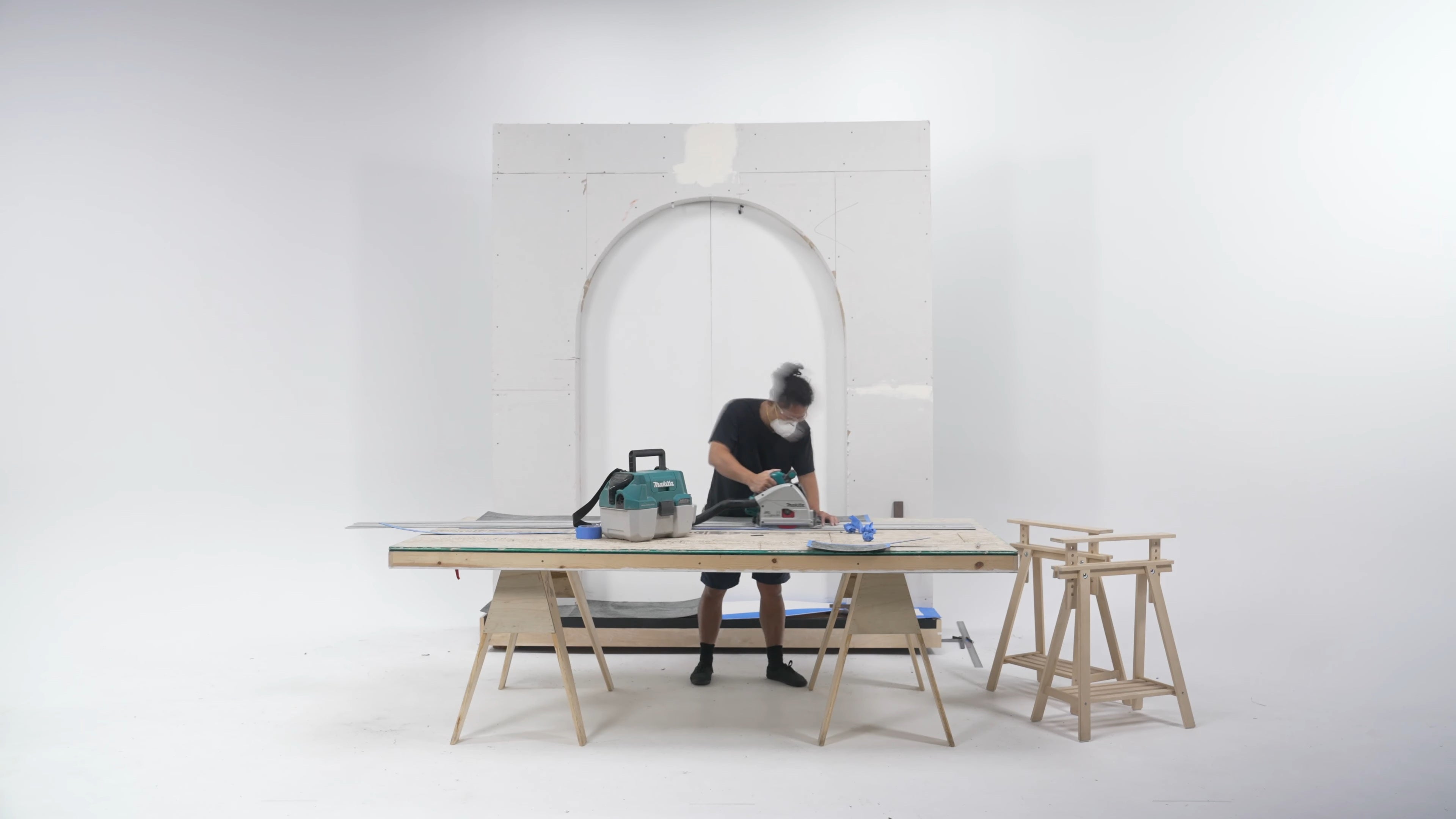 Full installation view of Stonovia flexible stone veneer being cut on a work table