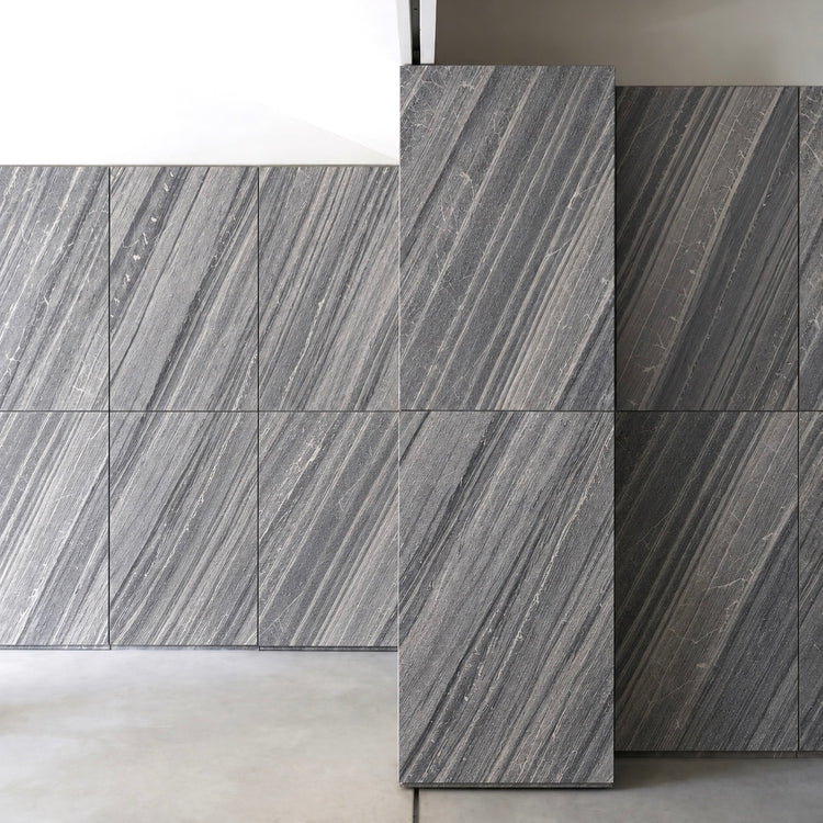 Lanita gray stone veneer panel layout in a bright architectural interior.