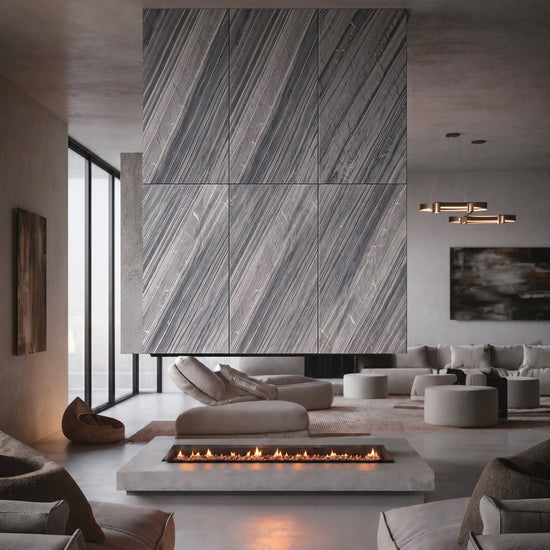 Lanita gray stone veneer feature wall above a linear fireplace in a lounge.